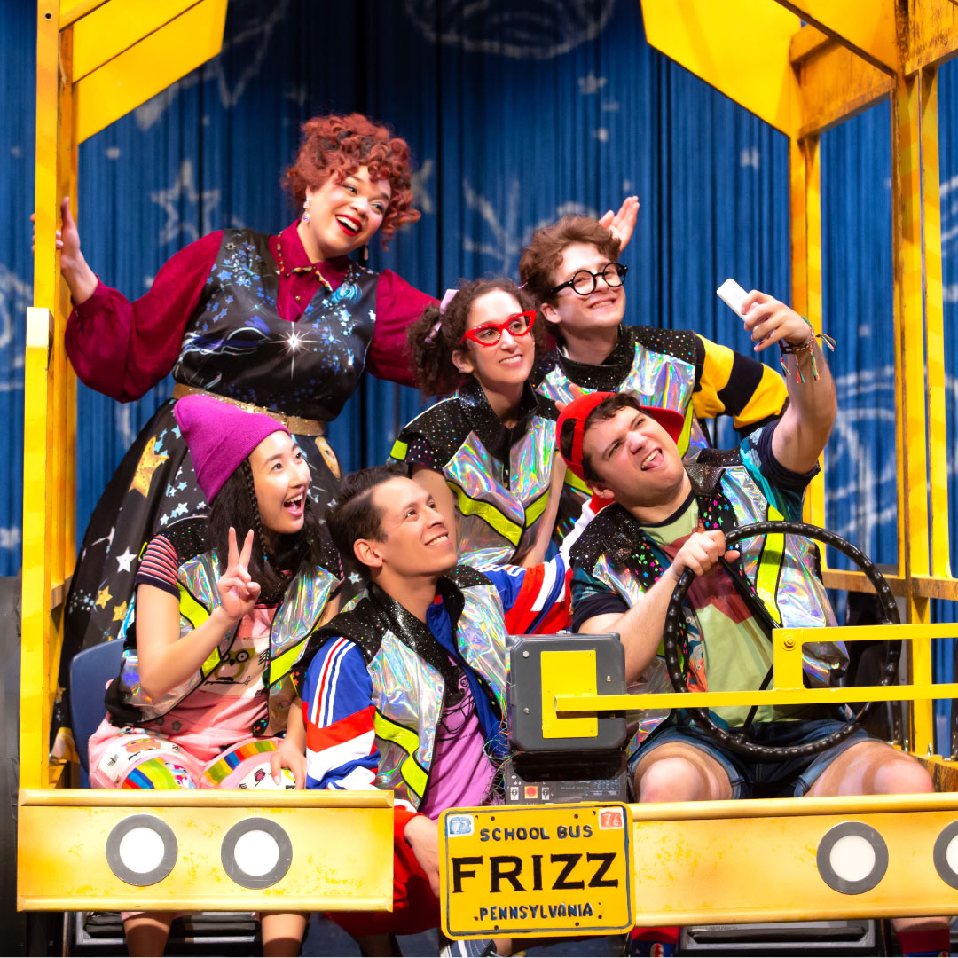 magicschool onstage photo of ms frizzle and group riding the magic school bus in the stage production