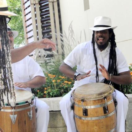 haitian group tati nuzi and friends stands together wearing colorful outfits
